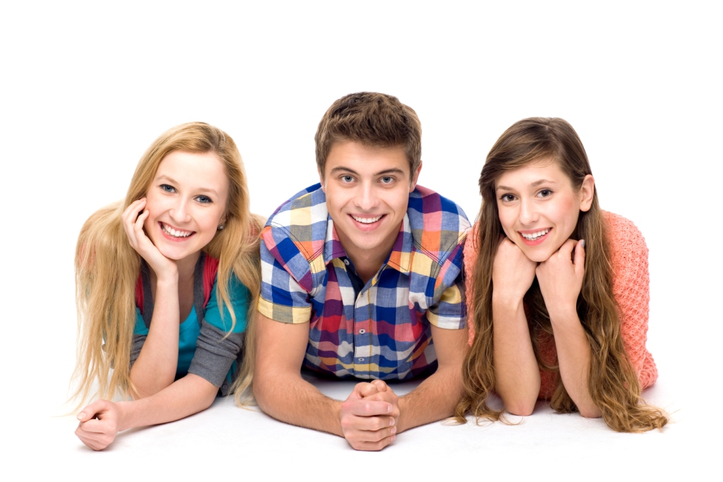 Three young friends lying down